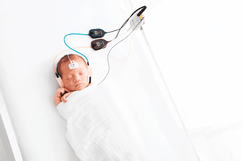 Newborn hearing screening with handheld device at bedside