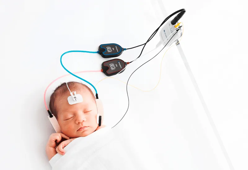 Newborn hearing screening with handheld device at bedside