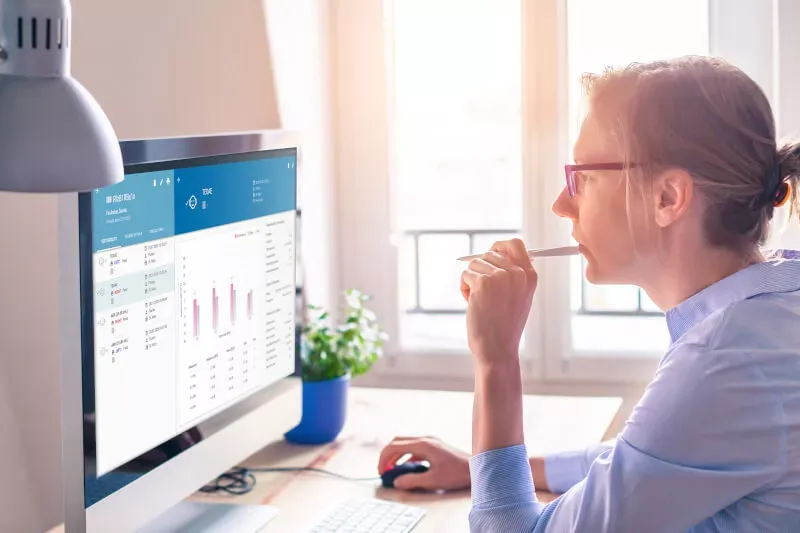 A woman exporting data manually or automatically for transfer to tracking centers